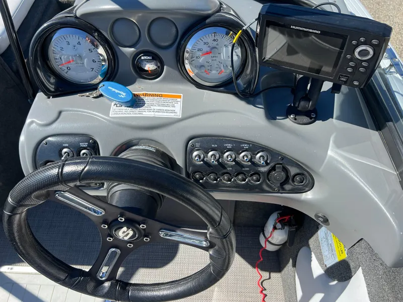 Slide: The Image of Dashboard of 2017 Smoker Craft 172 Ultima Fish n Ski boat with gauges and controls. - 24