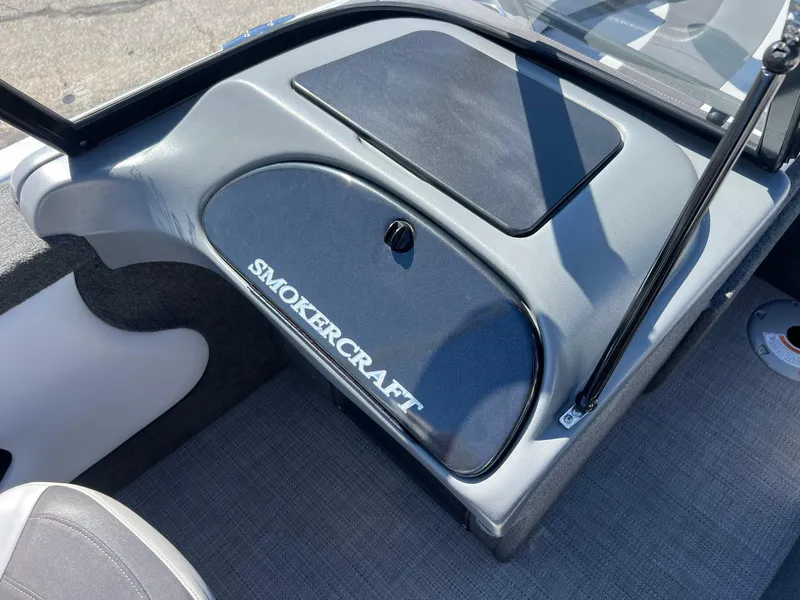 Slide: The Image of 2017 Smoker Craft 172 Ultima Fish n Ski boat interior, featuring dashboard and storage compartment. - 28