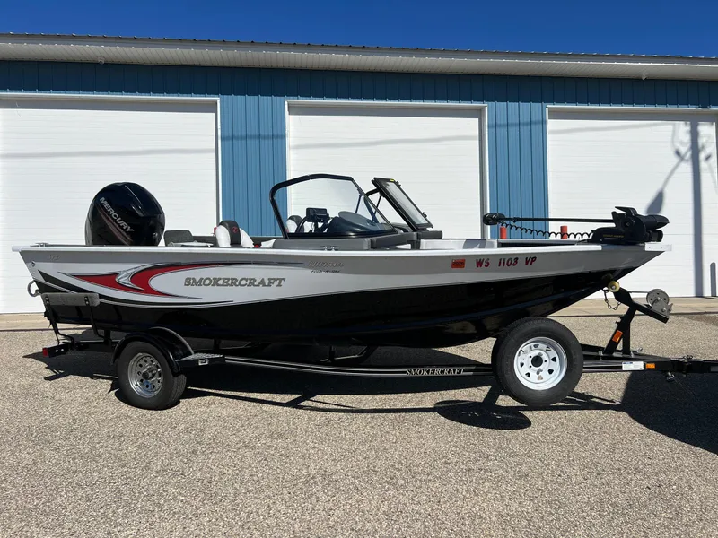 Slide: The Image of 2017 Smoker Craft 172 Ultima Fish n Ski boat on trailer, parked outdoors. - 5