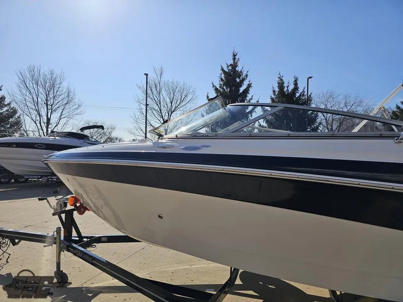 Slide: The Image of 2007 Four Winns 210 Horizon boat on trailer under clear blue sky. - 19
