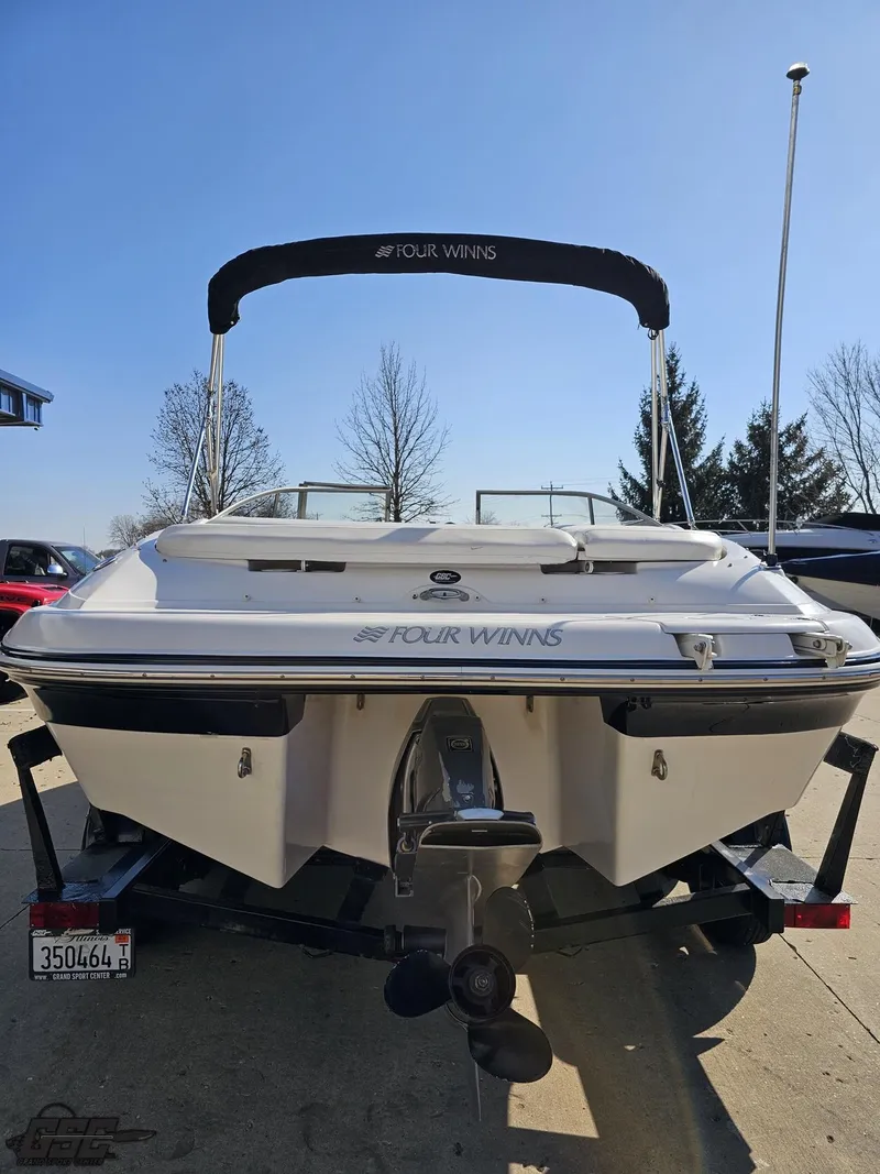 Slide: The Image of 2007 Four Winns 210 Horizon boat, rear view, on trailer, sunny day. - 25