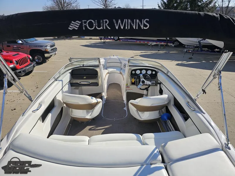 Slide: The Image of 2007 Four Winns 210 Horizon boat interior with seating and steering wheel. - 29