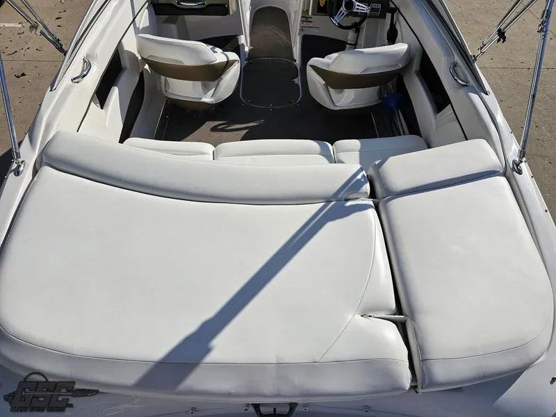 Slide: The Image of 2007 Four Winns 210 Horizon boat interior with white seating and spacious layout. - 31