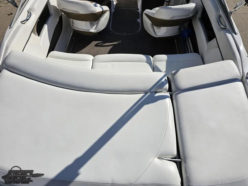 Slide: The Image of 2007 Four Winns 210 Horizon boat interior with white seating and sleek design. - 32
