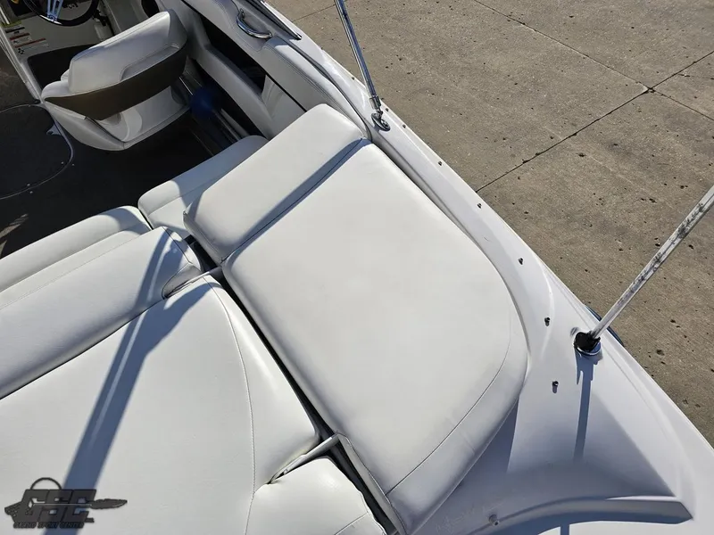 Slide: The Image of 2007 Four Winns 210 Horizon boat interior with white seating and sleek design. - 34