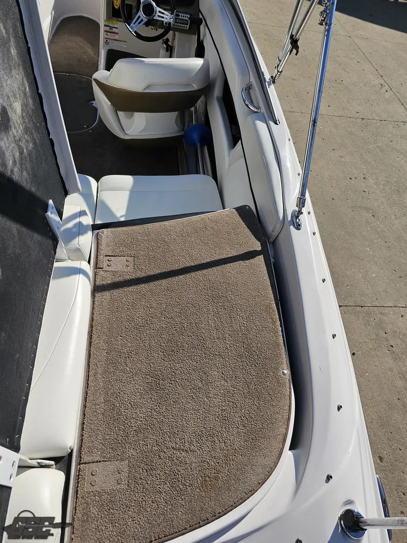 Slide: The Image of 2007 Four Winns 210 Horizon boat interior with seating and steering wheel. - 35
