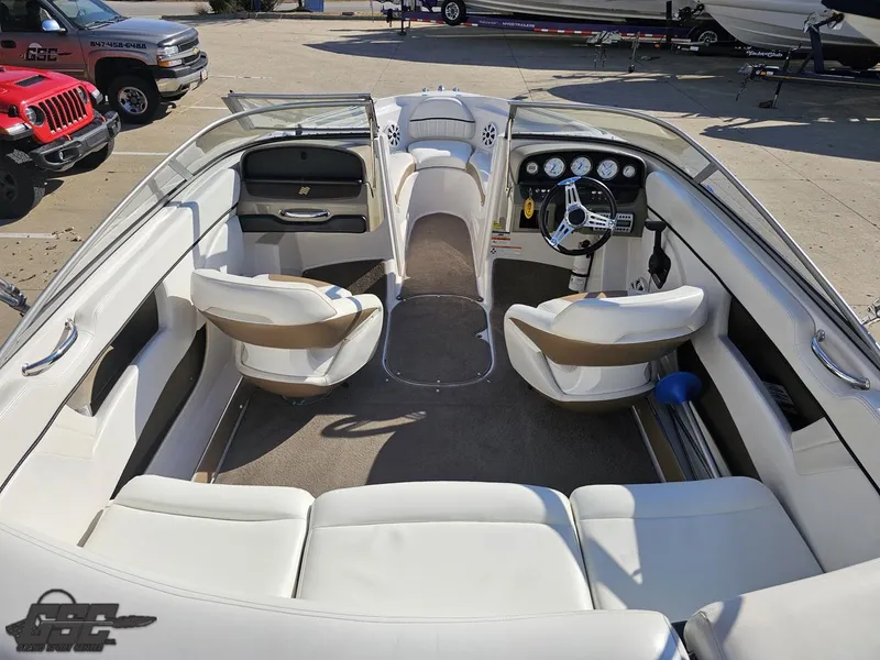 Slide: The Image of 2007 Four Winns 210 Horizon boat interior with white seating and dashboard. - 36