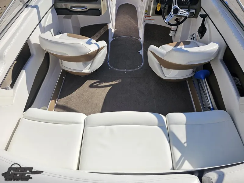 Slide: The Image of Interior of 2007 Four Winns 210 Horizon boat with white seating and steering wheel. - 37