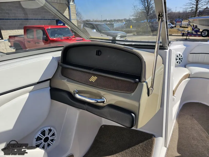 Slide: The Image of 2007 Four Winns 210 Horizon boat interior with glove compartment and speaker. - 43