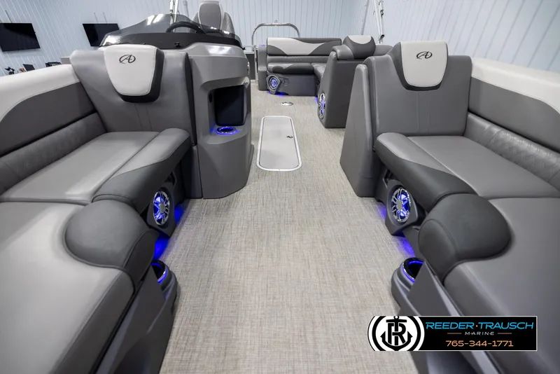 Slide: The Image of 2022 Avalon 2285 LSZ CRB boat interior with gray seating and blue LED lighting. - 13