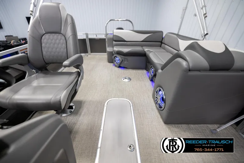 Slide: The Image of 2022 Avalon 2285 LSZ CRB boat interior with modern seating and blue LED lighting. - 14
