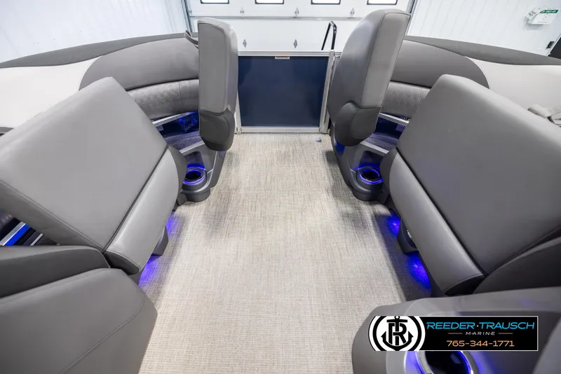 Slide: The Image of Interior of 2022 Avalon 2285 LSZ CRB pontoon boat with modern seating and blue LED lighting. - 19