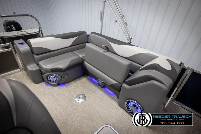 Slide: The Image of Luxurious seating in 2022 Avalon 2285 LSZ CRB pontoon boat with blue LED lighting. - 22