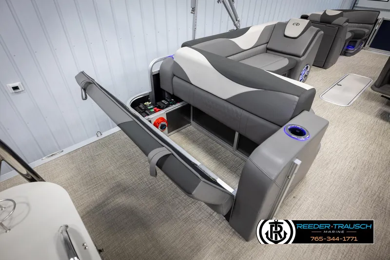 Slide: The Image of 2022 Avalon 2285 LSZ CRB boat interior with gray seating and storage compartments. - 25