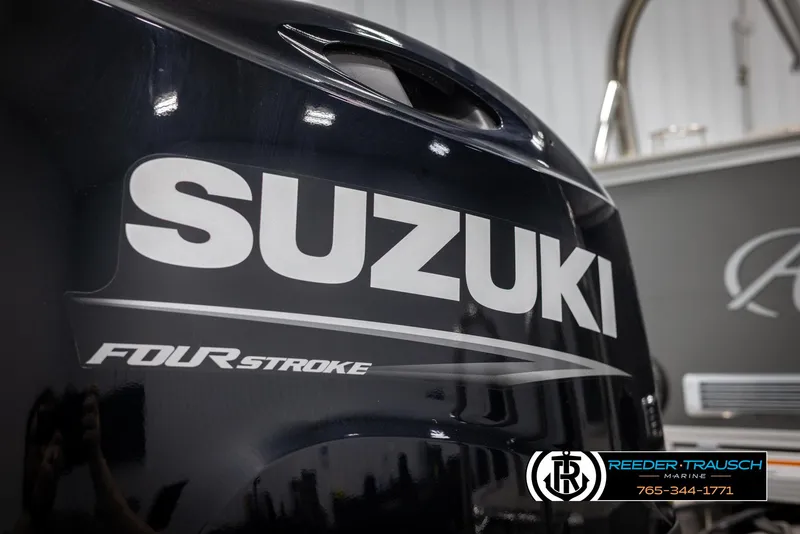 Slide: The Image of Suzuki four-stroke engine on 2022 Avalon 2285 LSZ CRB boat, Reeder-Trausch Marine branding. - 44
