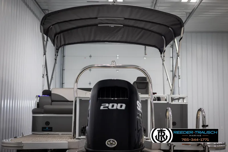 Slide: The Image of 2022 Avalon 2285 LSZ CRB pontoon boat with 200 HP engine in storage. - 7