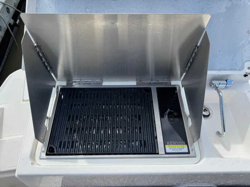Slide: The Image of Outdoor grill on a 2021 Cutwater C-24 Coupe boat. - 13