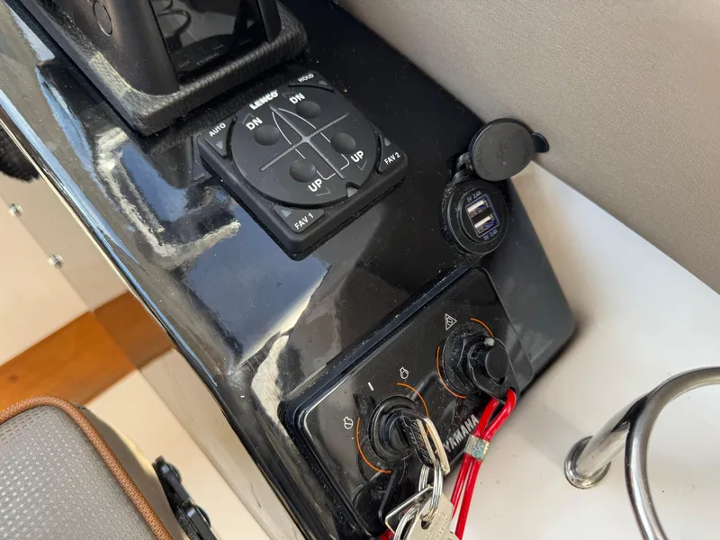 Slide: The Image of Control panel of a 2021 Cutwater C-24 Coupe boat with keys and switches. - 26