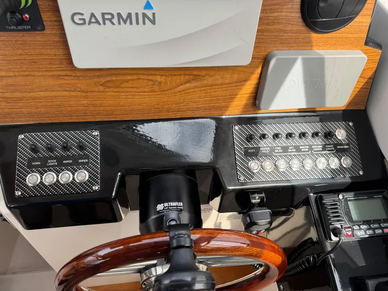 Slide: The Image of 2021 Cutwater C-24 Coupe dashboard with Garmin navigation and control panels. - 29