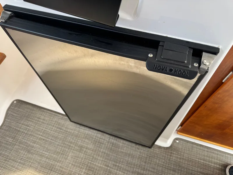 Slide: The Image of Nova Kool refrigerator in 2021 Cutwater C-24 Coupe boat interior. - 31