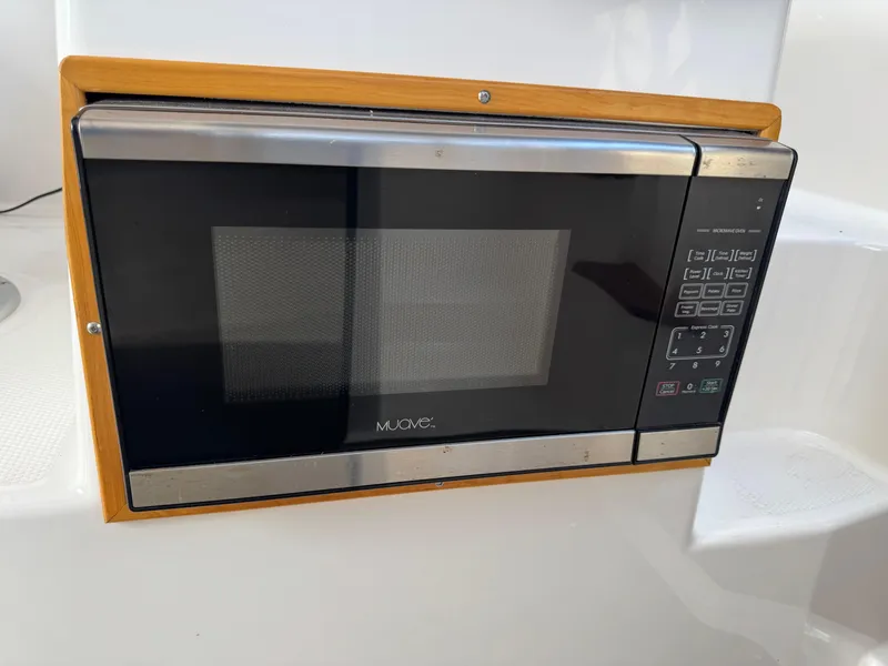 Slide: The Image of Built-in microwave in 2021 Cutwater C-24 Coupe boat kitchen. - 32