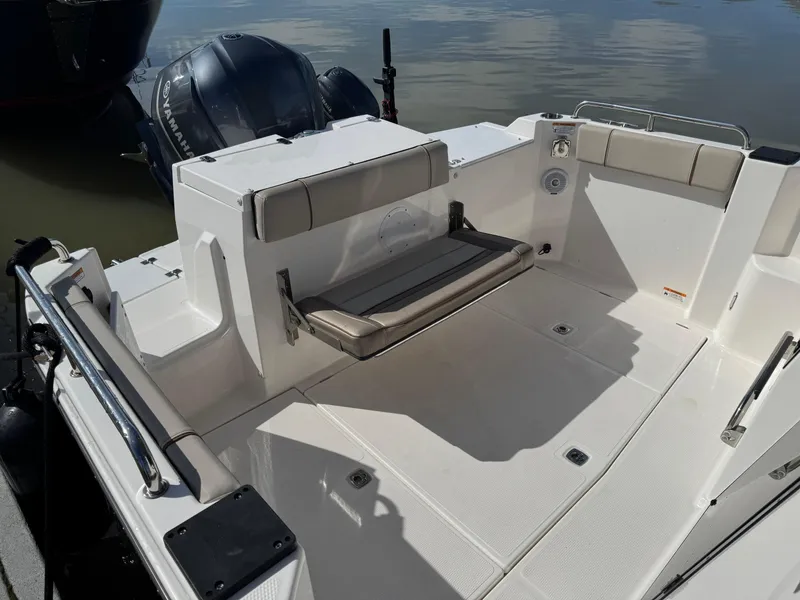 Slide: The Image of 2021 Cutwater C-24 Coupe boat deck with seating and outboard motors. - 9