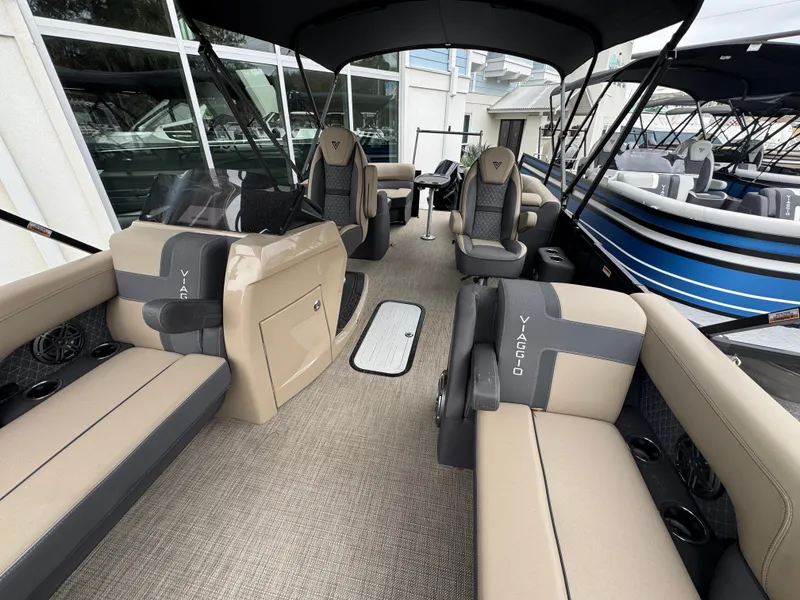 Slide: The Image of Viaggio Lago Z-U 2025 pontoon boat interior with beige seating and modern design. - 4