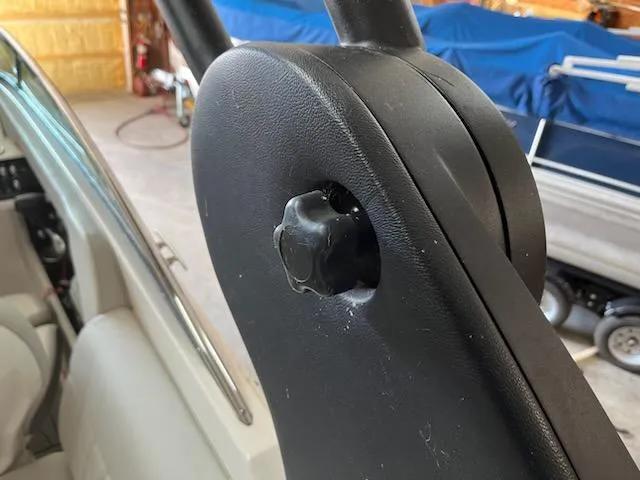 Slide: The Image of Close-up of a 2021 Sea Ray 250SLX boat's adjustable seat mechanism. - 24