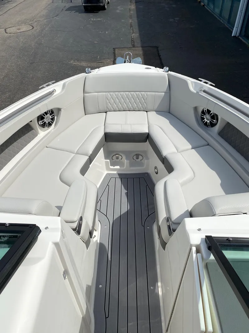 Slide: The Image of 2021 Sea Ray 250SLX boat interior with white seating and modern design. - 3