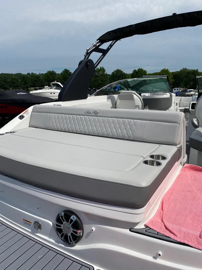 Slide: The Image of 2021 Sea Ray 250SLX boat with spacious seating and sleek design. - 5
