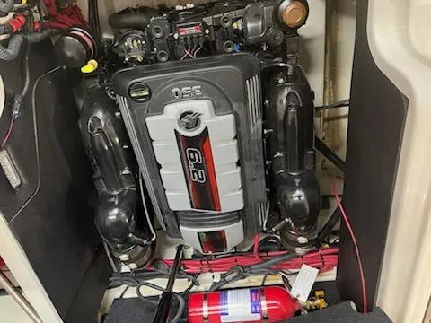 Slide: The Image of Engine compartment of a 2021 Sea Ray 250SLX with a 6.2L engine and fire extinguisher. - 6