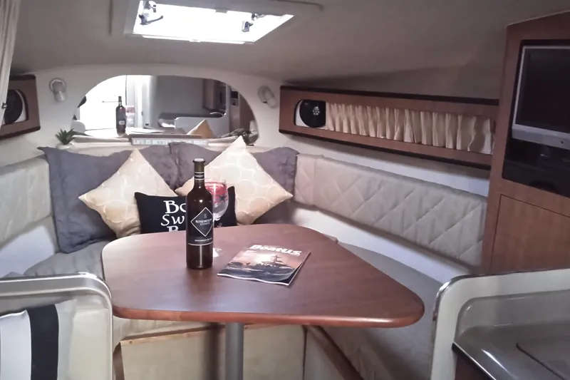 Slide: The Image of Luxurious interior of 2006 Sea Ray 280 Sundancer with cozy seating and elegant decor. - 13