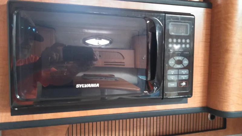 Slide: The Image of Sylvania microwave in 2006 Sea Ray 280 Sundancer boat interior. - 17