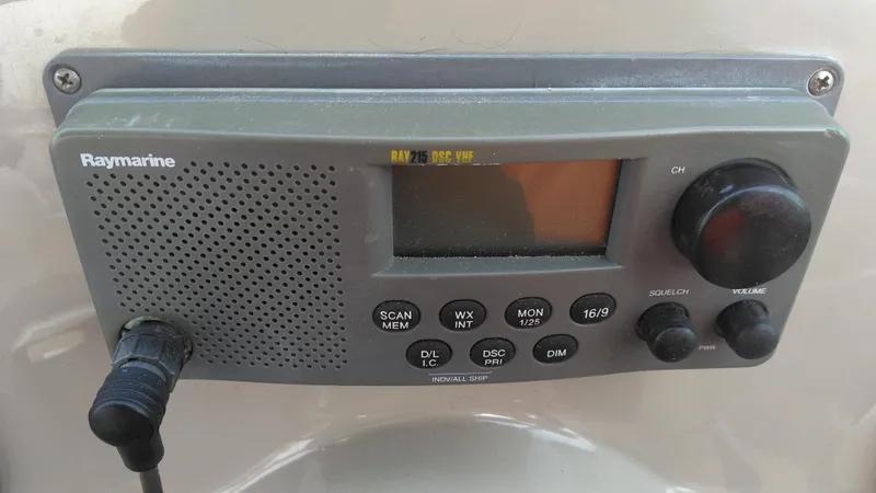 Slide: The Image of Raymarine marine radio on 2006 Sea Ray 280 Sundancer boat dashboard. - 24