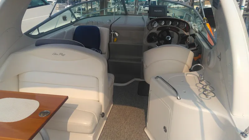 Slide: The Image of 2006 Sea Ray 280 Sundancer interior with seating and helm, showcasing luxury design. - 33