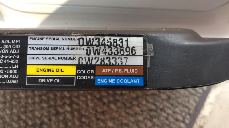 Slide: The Image of Serial numbers and fluid labels on a 2006 Sea Ray 280 Sundancer boat. - 37