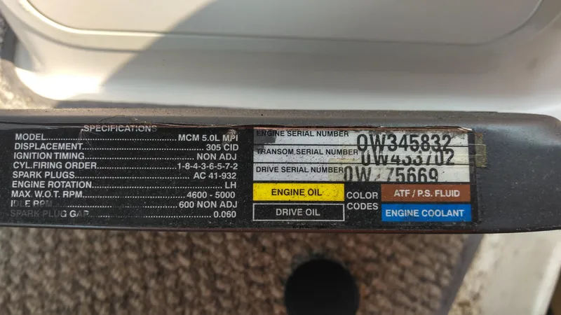 Slide: The Image of Engine specifications label for 2006 Sea Ray 280 Sundancer, showing serial numbers and maintenance details. - 38