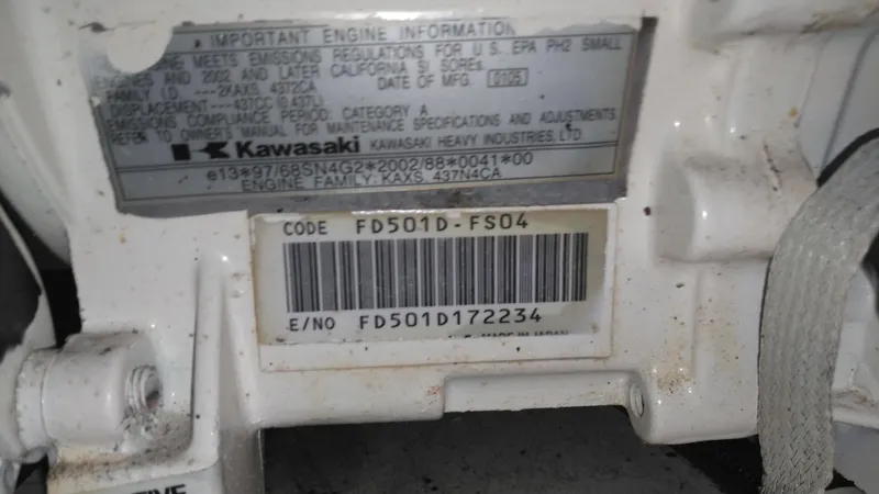 Slide: The Image of Kawasaki engine label on 2006 Sea Ray 280 Sundancer, showing code and serial number details. - 41