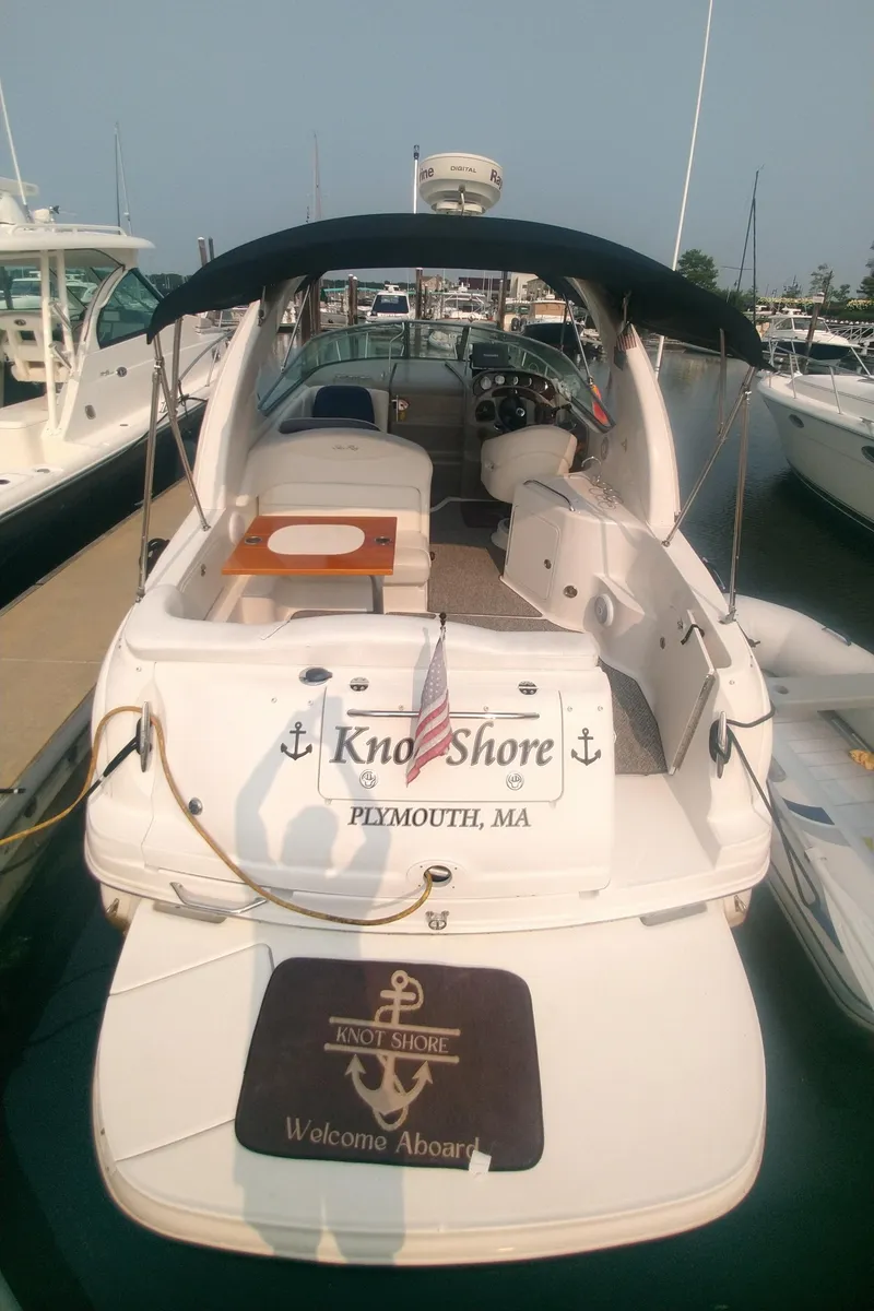 Slide: The Image of 2006 Sea Ray 280 Sundancer docked, featuring spacious deck and seating, located in Plymouth, MA. - 8