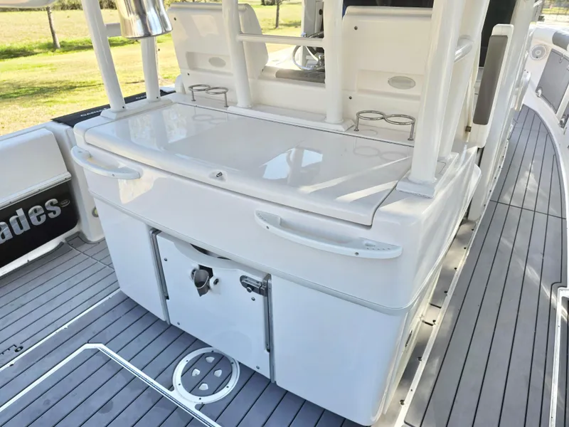 Slide: The Image of 2015 Everglades 355 Tournament boat deck with storage and seating area. - 15