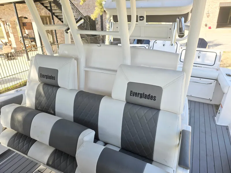 Slide: The Image of 2015 Everglades 355 Tournament boat interior with gray and white seating. - 17
