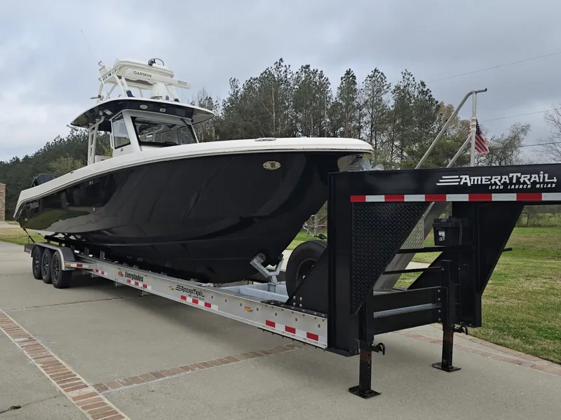 Slide: The Image of 2015 Everglades 355 Tournament boat on AmeraTrail trailer, parked outdoors. - 8