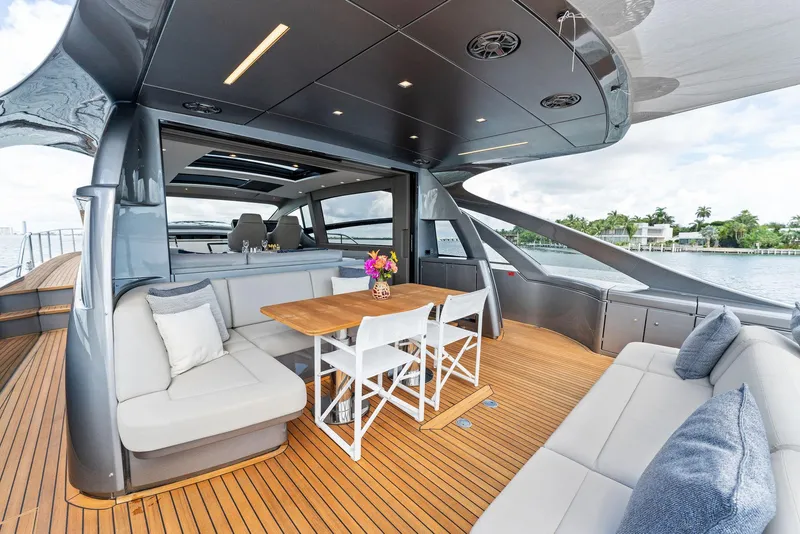 Slide: The Image of Luxurious 2022 Pershing 7X yacht with elegant seating and wooden deck. - 11