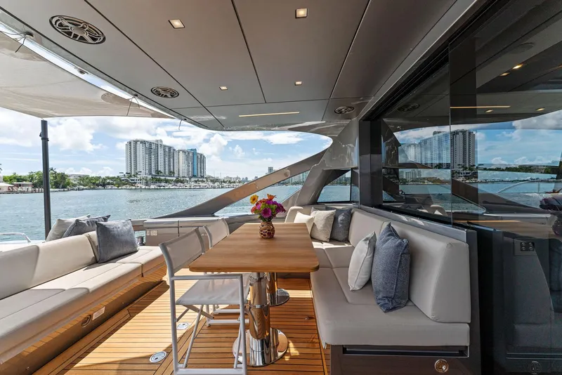 Slide: The Image of Luxurious 2022 Pershing 7X yacht deck with elegant seating and waterfront view. - 15