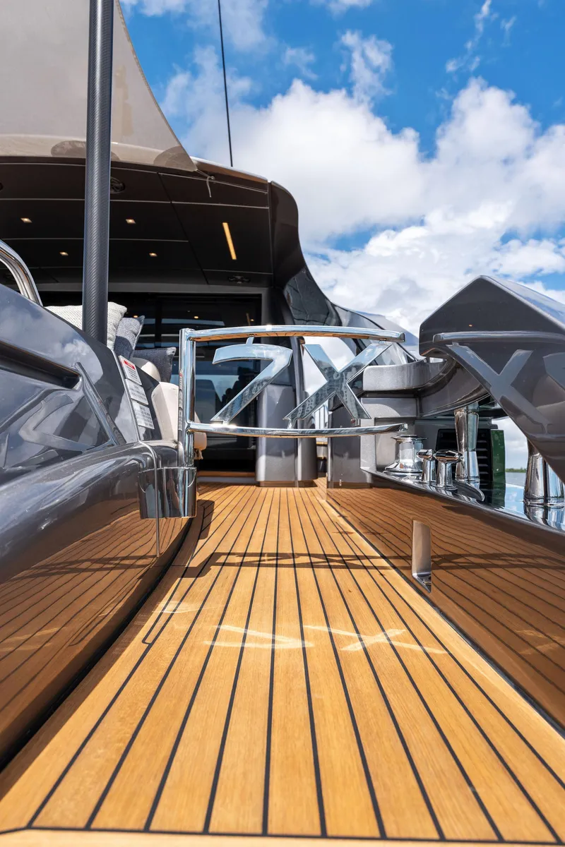 Slide: The Image of Luxury Pershing 7X yacht deck, 2022 model, with sleek design and wooden flooring. - 18