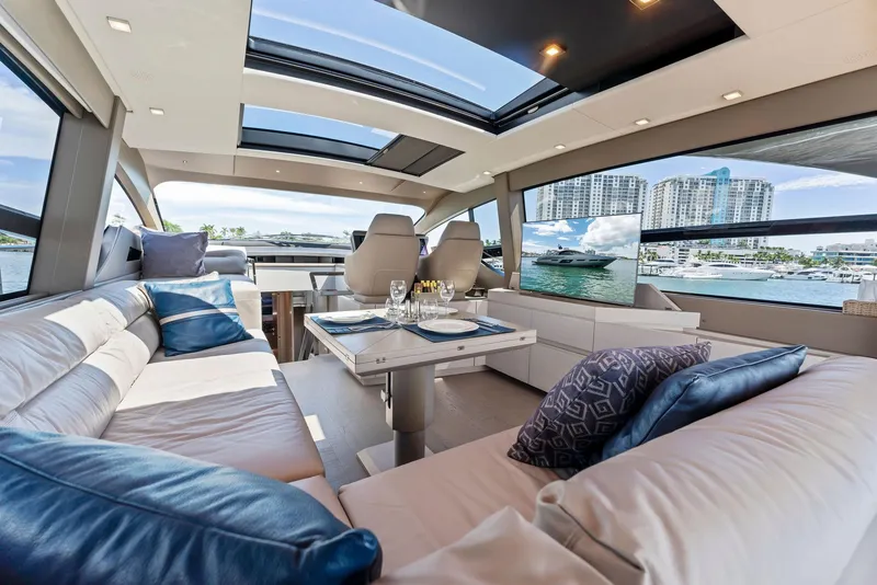 Slide: The Image of Luxurious interior of 2022 Pershing 7X yacht with elegant seating and panoramic windows. - 19