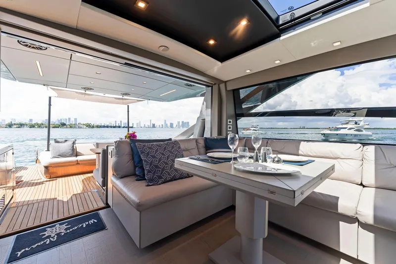 Slide: The Image of Luxurious interior of 2022 Pershing 7X yacht with elegant dining area and scenic ocean view. - 22