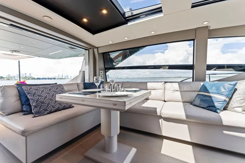 Slide: The Image of Luxurious interior of 2022 Pershing 7X yacht with elegant seating and dining area. - 23