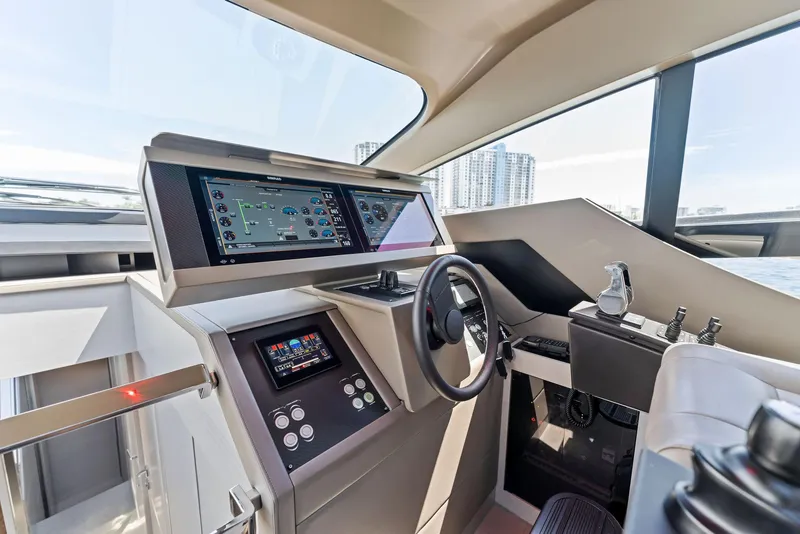 Slide: The Image of Interior cockpit of 2022 Pershing 7X yacht with modern navigation controls. - 27