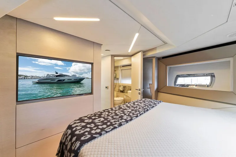 Slide: The Image of Luxurious 2022 Pershing 7X yacht bedroom interior with modern design and scenic window view. - 34